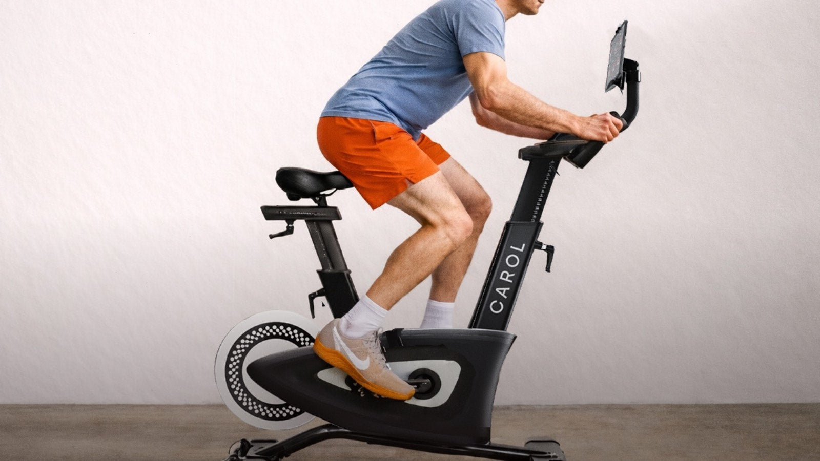 Rider on a CAROL Bike with the tablet screen in view